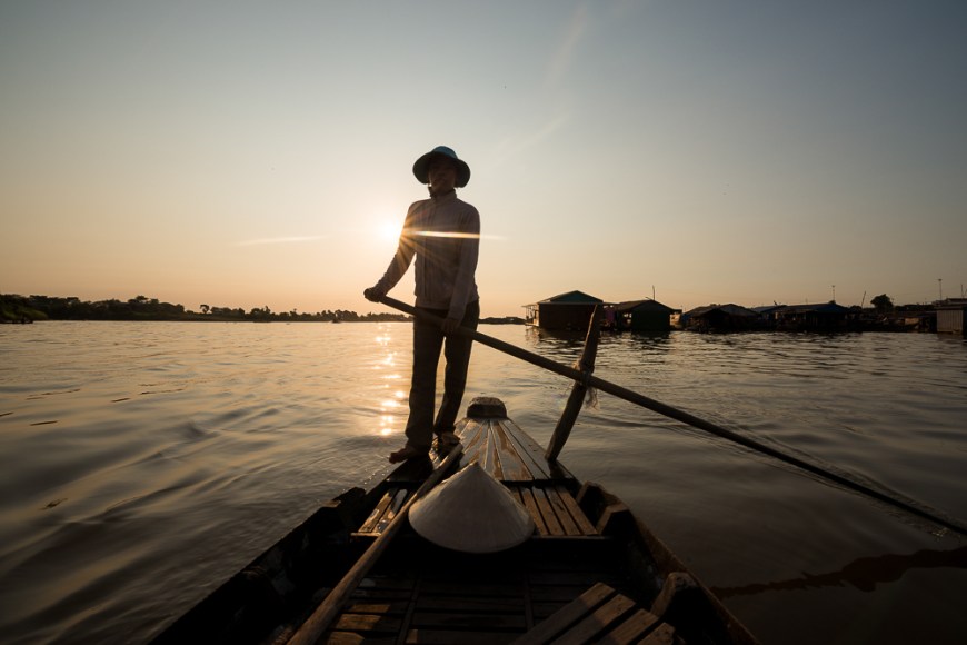 Boatwoman 'Mai'  guiding boat through Tonle Sap River, Floating Villages of Phoum Kandal, Kompong Chnang, Cambodia, Indochina, Asia