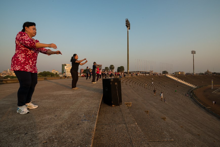 Aerobics Sessions at Olympic Stadium at dusk, Phnom Penh, Cambodia, Indochina, Asia