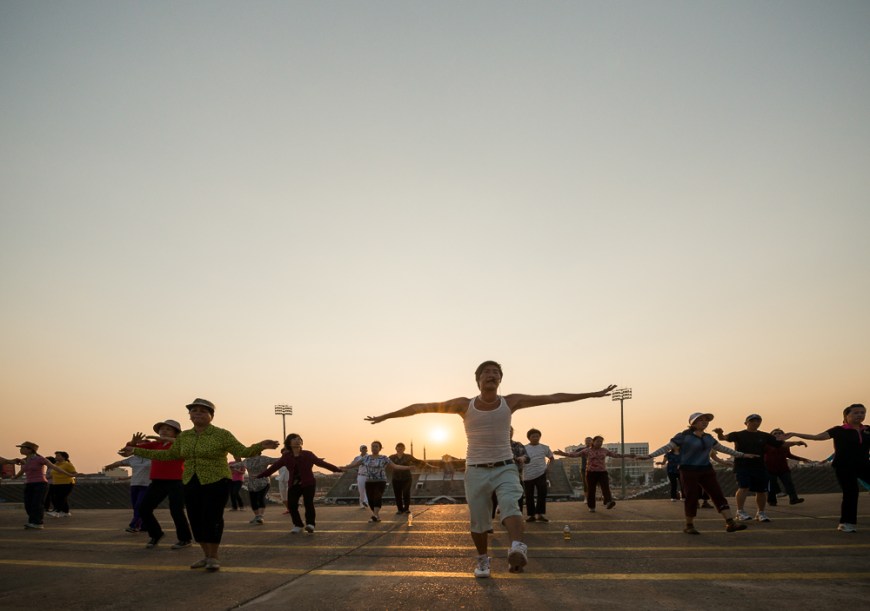 Aerobics Sessions at Olympic Stadium at dusk, Phnom Penh, Cambodia, Indochina, Asia