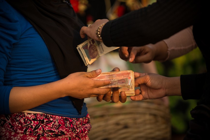 Dawn at Kampot Harbour as fishing boats return with nights catch, Kampot Province, Cambodia, Indochina, Asia