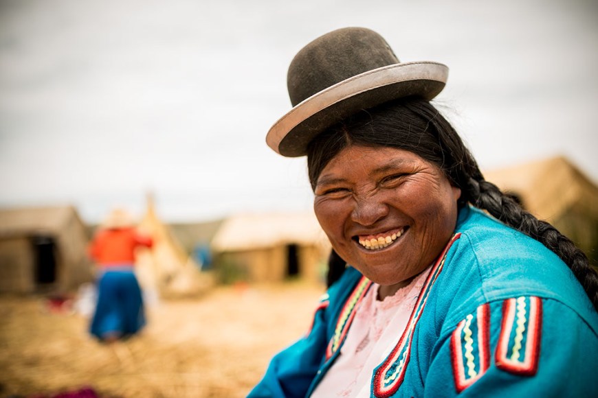 Portrait of Benita wearing traditional Bolivian bowler hat, Uros Islands, Lake Titicaca, Puno, Peru