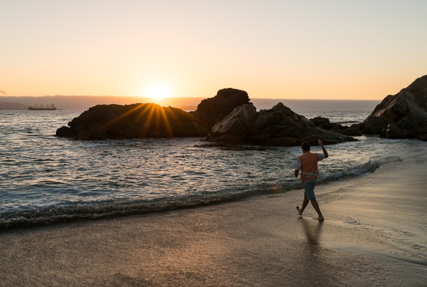 Man fishing at Playa Los Marineros at dusk, Viña del Mar, Central Coast, Chile