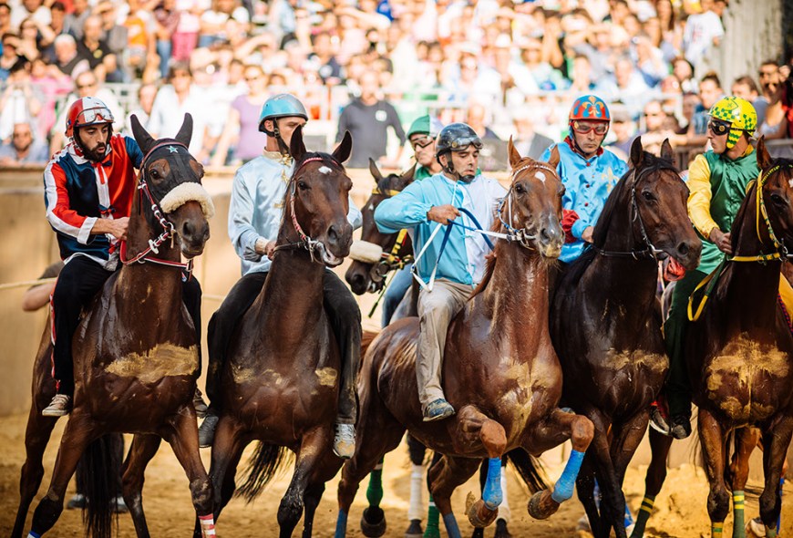 Jockeys jostle for position for the start of the Palio Di Asti on September 21, 2014 in Asti, Italy