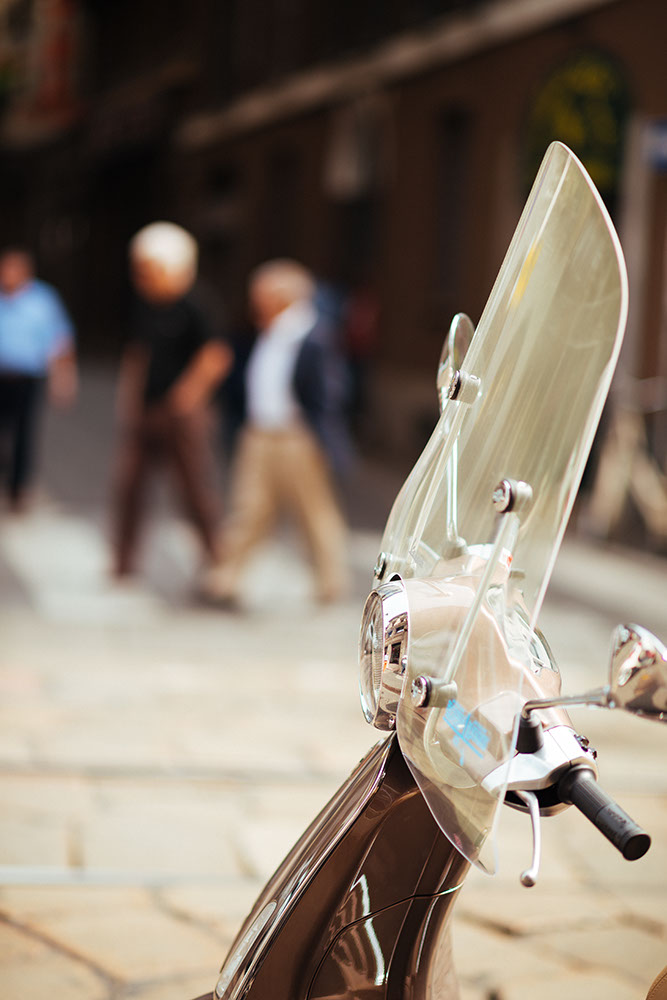 Parked 'Vespa' moped, Milan, Lombardy, Italy
