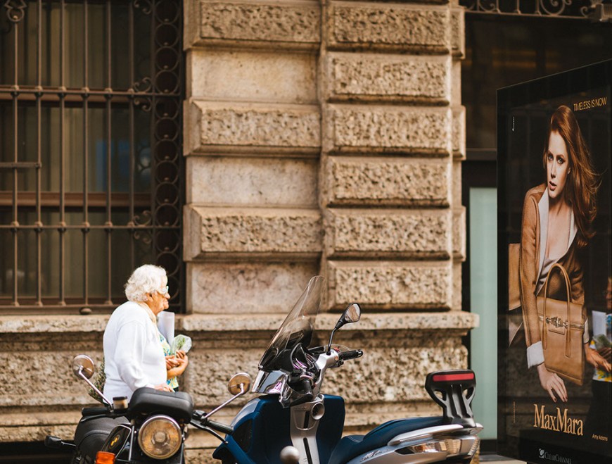 Advertising board on bus stop, Milan, Lombardy, Italy