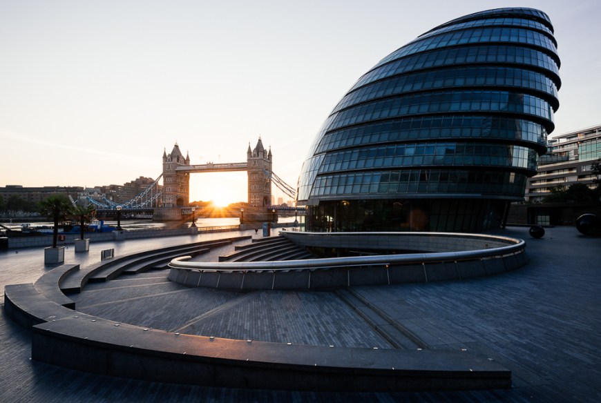 Sunrise behind Tower Bridge and The Mayor's Building, London, England