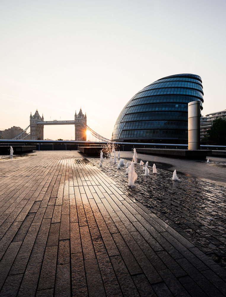 Sunrise behind Tower Bridge and The Mayor's Building, London, England