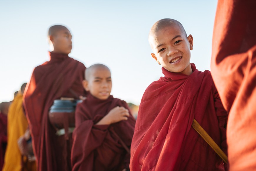 Buddhist monks collecting alms golden rock