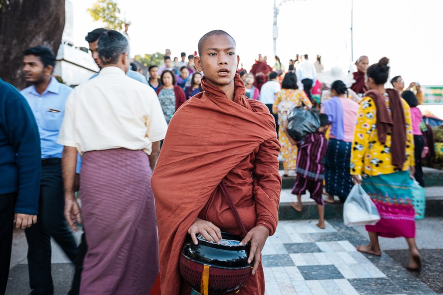Buddhist monks collecting alms golden rock