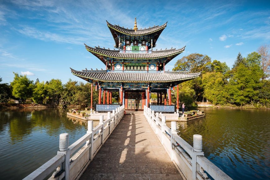 Moon Embracing Pavilion and bridge, Black Dragon Pool Park with Yulong Xueshan (Jade Dragon) Mountain, Lijiang, Yunnan Province, China