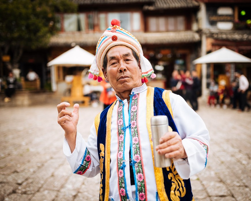 Portrait of man in traditional clothing, Lijiang, Yunnan Province, China