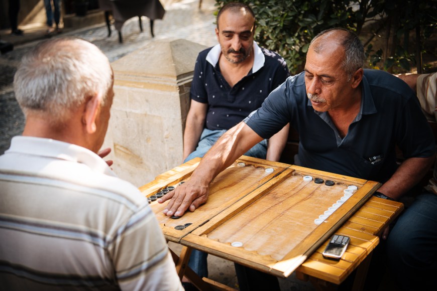 Men playing Backgammon in Old Town, Baku, Azerbaijan