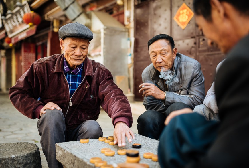 Men playing traditional game of Xiangqi (Chinese Chess), Dali, Yunnan Province, China